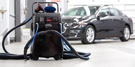 Image of clean sanding system in a body shop.

